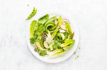 Wall Mural - Fresh green vegan salad with asparagus and green peas