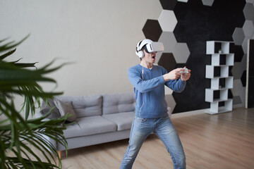 Wall Mural - man with virtual reality headset is playing game.
