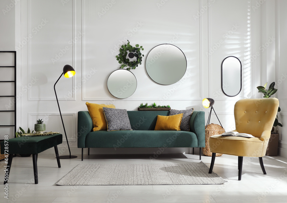 Modern living room interior with stylish comfortable sofa - obrazy, fototapety, plakaty 
