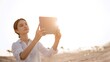 © D'Action Images - Smiling teenage girl having a video chat through laptop on background the beach during sunset. Summer vacation concept, studying online with tablet, distance learning, self education, beach work
