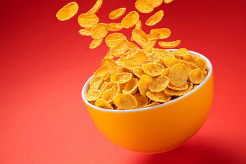 Wall Mural - Bowl of corn flakes. Falling cornflakes with copy space