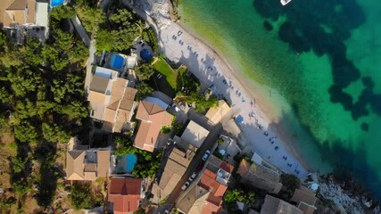 Wall Mural - Beautiful beach with turquoise waters near authentic villas. Corfu, Greece. Top-down view.