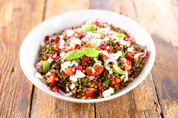 Wall Mural - lentil salad with tomato, cheese and pomegranate