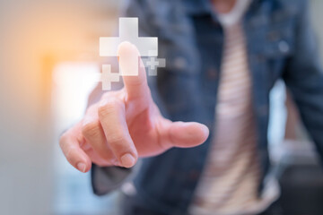 young men wearing jeans shirts are touching plus sign or Medicine health hospital signs symbol