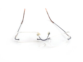 Front view of modern minimalist vision glasses on white background. Close up of clear glasses and glasses frame.