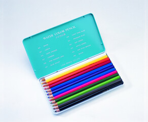 Poster - Box of colored wooden pencils on a white background