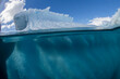 © robertharding - Half above and half below photo of an iceberg off Danco Island