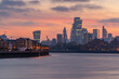 © robertharding - View of The City skyline at sunset from the Thames Path, London, England