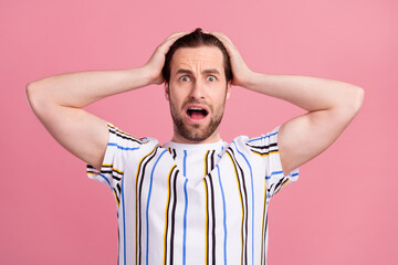 Sticker - Photo portrait man in t-shirt shocked keeping head got problems isolated pastel pink color background