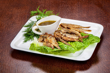 Fried barabulka fish with sauce