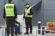 © Photographee.eu - Two police officers talking to man on the street