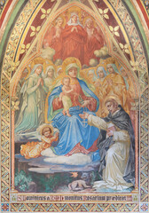  VIENNA, AUSTIRA - JUNI 17, 2021: The fresco of  Madonna presenting the Rosary to st. Dominic the Votivkirche church by brothers Carl and Franz Jobst (sc. half of 19. cent.).