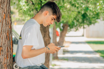 Poster - boy on the street with mobile phone