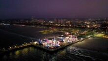Aerial View Of The Boardwalk, Ferris Wheel, And Roller Coaster At The Santa Monica Pier In Southern Ca.