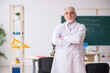 © Elnur - Old male chemist teacher in the classroom