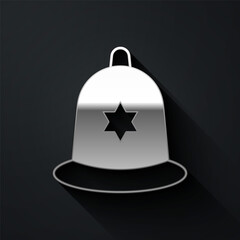 Sticker - Silver British police helmet icon isolated on black background. Long shadow style. Vector