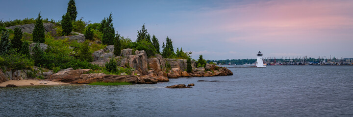 Wall Mural - Palmer Island Light Station in the Acushnet River in New Bedford Harbor, Massachusetts. Panoramic Sunset Seascape with Lighthouse.