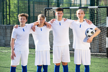 Portrait Of male high school soccer team on the field