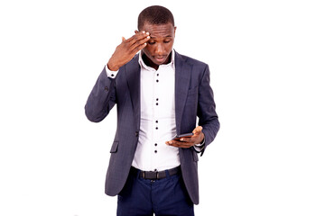 young worried businessman using a mobile phone.