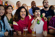 © Rawpixel.com - Friends cheering sport at bar together