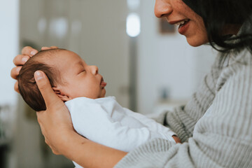 Wall Mural - mother holding her infant baby