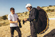 © Mediteraneo - Active senior paraglider on the ground prepairs to fly.