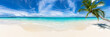 panorama view tropical beautiful paradise beach with coco palm tree and turquoise blue clear water. tourism vacation and relaxation wide background
