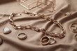 © New Africa - Stylish golden bijouterie on light brown fabric