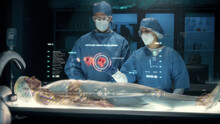 Team Of Surgeons Perform A Delicate Operation Using Modern Medical Full Body Surgical Augmented Reality Scanner On Female Patient Laying On Futuristic Holographic Bed Showing Skeletal System Graphics.