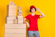 © deagreez - Photo portrait of woman smiling near boxes stack shipment service isolated vibrant yellow color background
