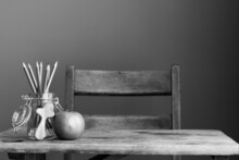 Old School Desk With Cross, Jar Of Pencils And Apple