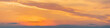 Fiery sunset, colorful clouds in the sky. Panorama