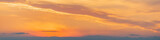 Fototapeta Tulipany - Fiery sunset, colorful clouds in the sky. Panorama