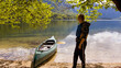 © 24K-Production - Child kayaking on a lake in nature at summer