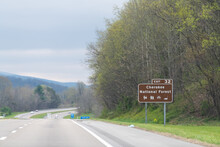 Smoky Mountains In North Carolina Or Tennessee With Cloudy Sky On South 25 Highway Road And Sign For Cherokee National Forest