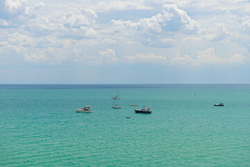 Wall Mural - Several boats and boats on a sunny summer day at sea