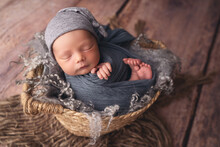 Sleeping Newborn Boy In The First Days Of Life. Newborn Photo Session.