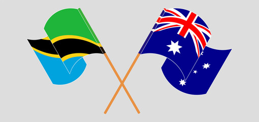 Crossed and waving flags of Tanzania and Australia