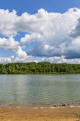 Wall Mural - Beautiful natural summer landscape with picturesque lake Senezh and cloudy sky. Moscow region, Russia