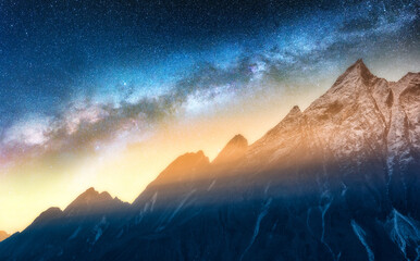 Wall Mural - milky way and snowy mountains at starry night. landscape. sky with stars and beautiful milky way, hi
