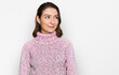 © Krakenimages.com - Young caucasian girl wearing wool winter sweater smiling looking to the side and staring away thinking.