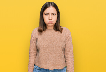 Canvas Print - Young beautiful woman wearing casual clothes puffing cheeks with funny face. mouth inflated with air, crazy expression.