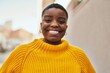 © Krakenimages.com - Young african american woman smiling happy standing at the city.