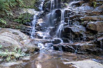 Poster - slow motion flowing water of a waterfall in the Blue Mountains, Australia