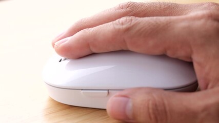 Poster - Static shot of a hand moving and clicking a mouse in slow motion