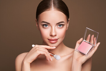 beauty woman with eye shadow makeup palette. model with healthy perfect skin, close up portrait. cos