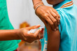 © avijit - a child is vaccinated by a doctor.