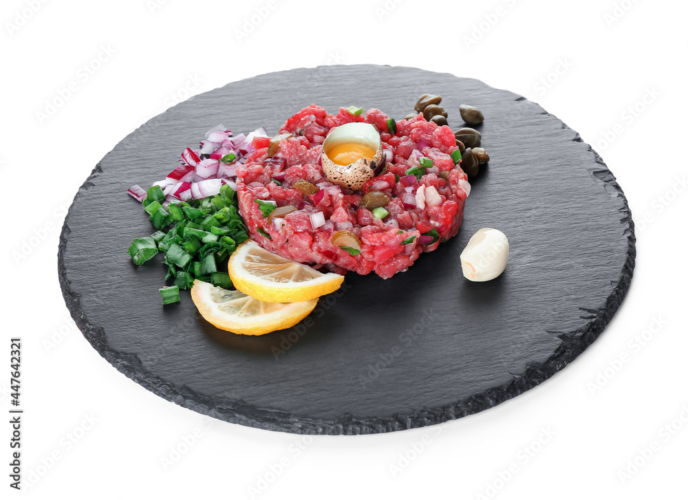 Slate plate with tasty beef and lemon tartare on white background