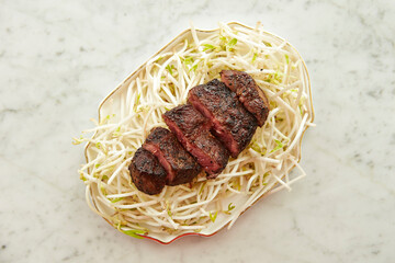 Wall Mural - Stir-fried Green Bean Sprouts and Beefsteak