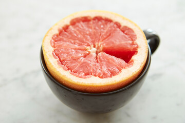 Wall Mural - Sliced grapefruit tea on marble background